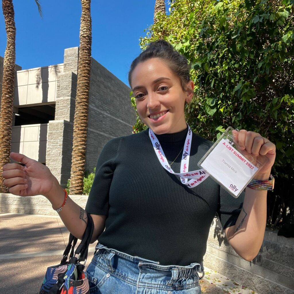 Tianna Mick holding name lanyard