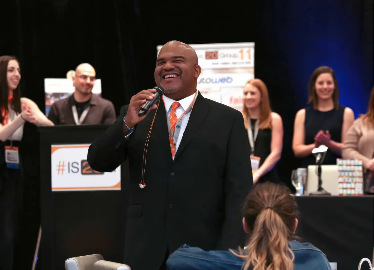 Automotive dealership sales training keynote speaker presenting leadership and performance strategies at industry event